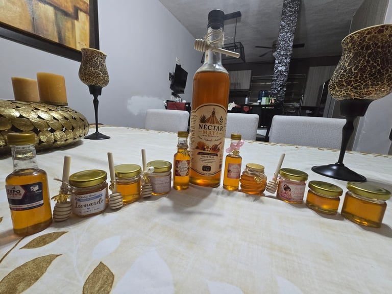 Display of various honey products and jars arranged on a white table in a modern kitchen setting.